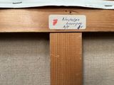a picture of a close up of a piece of wood with a label on it