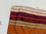 a close up of a striped cloth on a table