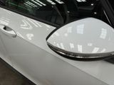 a close up of a car ' s side mirror with a reflection on it