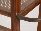 a wooden shelf with a glass door and a metal handle