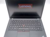 a close up of a laptop with a lenovo logo on the screen