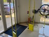 a bike that is parked in the room next to a bike rack