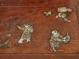 a wooden box with a picture of a man and a bird on it