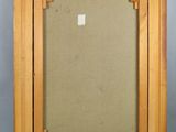 an old picture frame with a picture in it on a gray background