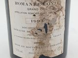 a close up of a bottle of wine on a table