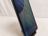 a close up of a tablet on a stand on a white surface