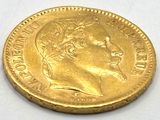 an image of a gold coin with a portrait of a man on it