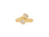 a gold ring with two diamonds on top of it