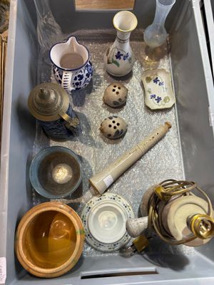 many different types of pottery in this box