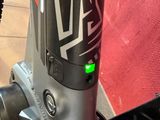a close up of a bike with a green light on it
