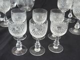 a lot of wine glasses that are sitting on a table