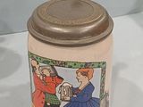 a ceramic jar with a cartoon on it on a table