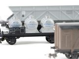 a toy train car with a bunch of containers on it