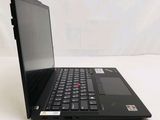 a black laptop computer sitting on a white surface