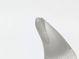 a sculpture of a fish that is on a table