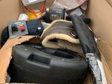 a cardboard box filled with assorted items for sale
