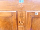 a close up of a wooden cabinet with a star on it