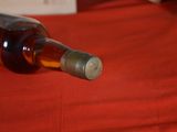 a bottle of wine that is sitting on a table