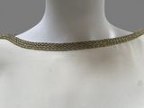 a close up of a mannequin neck with a gold chain