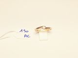two wedding rings sitting on top of a piece of paper