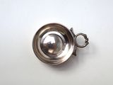 silver plated cup with handle on a white surface