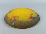 a picture of a yellow and red object on a white surface
