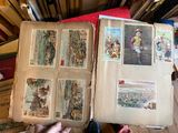 a person holding an open book with pictures on it