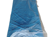 a blue mattress that is wrapped in plastic