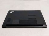 a laptop that is sitting on a white surface