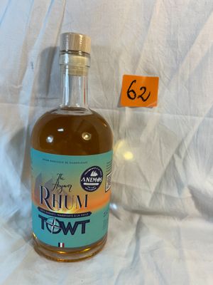 a bottle of rum that is sitting on a white sheet