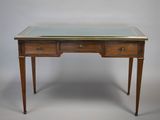 un bureau ancien avec un plateau en verre et deux tiroirs