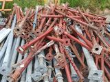 a large pile of old rusty pipes and pipes on the ground