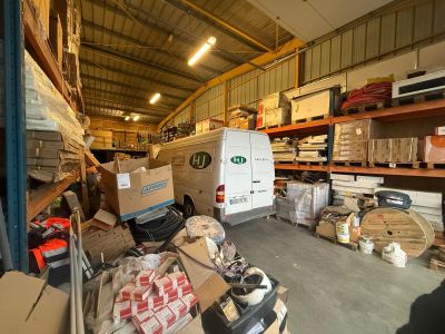 many boxes and boxes on the shelves in the garage