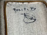 a picture of a ceramic vase with writing on it