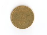 an old coin on a white surface with a white background
