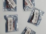 four bags of chocolates are sitting on a white surface