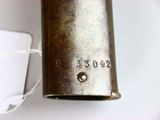 a metal object with a tag attached to it