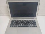 an apple macbook air laptop computer sitting on top of a white table