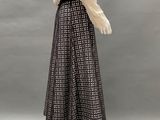 a mannequin mannequin wearing a white shirt and black skirt