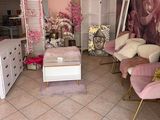 a living room with a lot of furniture and flowers