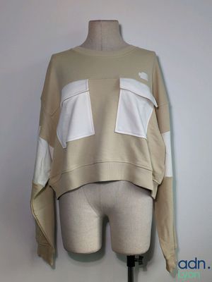 a close up of a mannequin torso with a sweater on it
