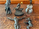 a lot of figurines that are on a table