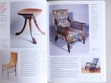 an open book with a picture of a chair and a table in it