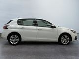 a picture of a white car parked in a parking lot