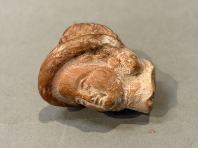 a close up of a piece of pottery on a table