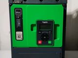 a green machine that is sitting on a table
