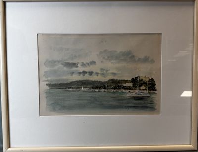 framed watercolor painting of a view of a beach with a sailboat in the water