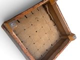 an old wooden box that has a hole in it