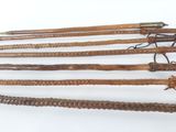 several different types of wooden sticks are arranged on a white surface