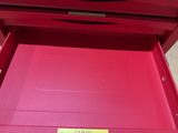 a red drawer that has a sign on it